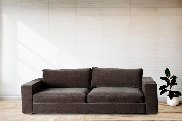 Free Photo sofa by a tiled wall