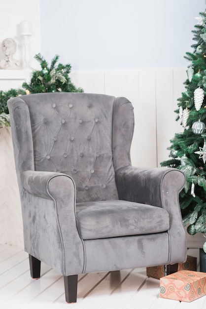 Free Photo sofa next to christmas tree