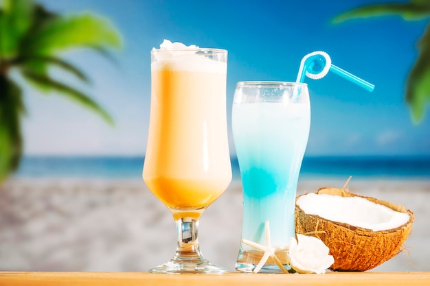 Soft yellow frozen blue drinks and cracked coconut