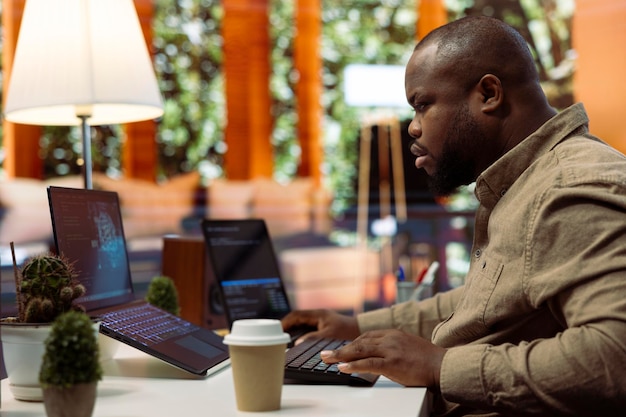 Free photo software engineer coding on a laptop focusing on deep learning