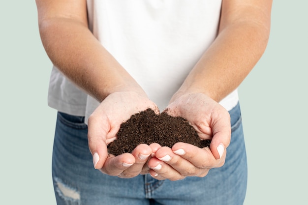 Soil in hand for reforestation to prevent the climate change