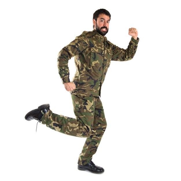 Soldier running fast over white background