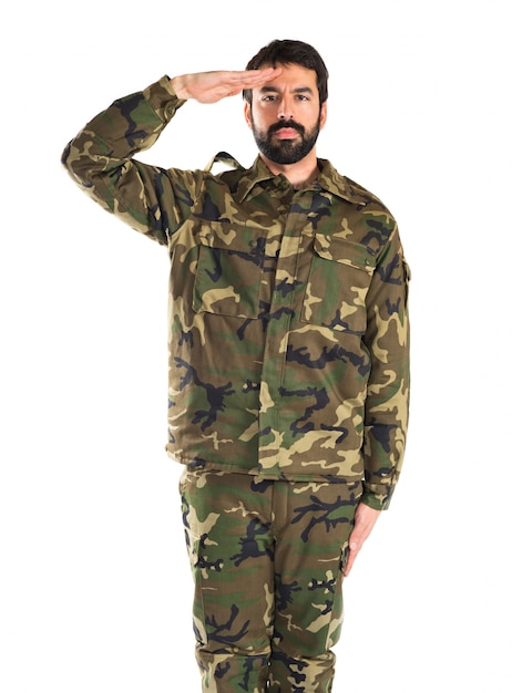 Soldier saluting over white background