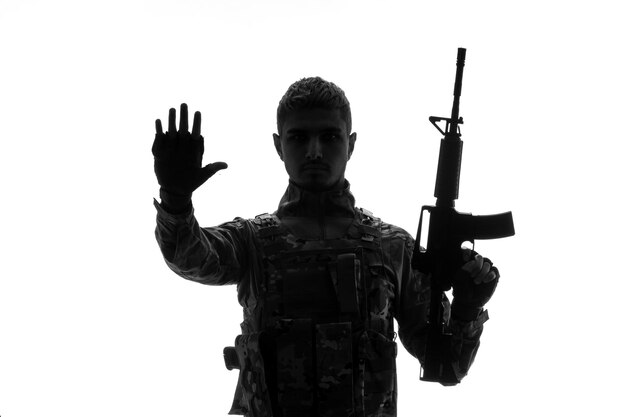 Soldier silhouette army tough handsome serious strong soldier in uniform raising hand