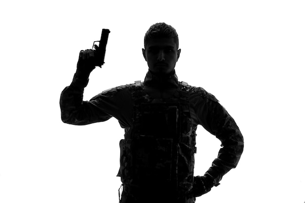 Soldier silhouette tough handsome serious strong army soldier in uniform with gun