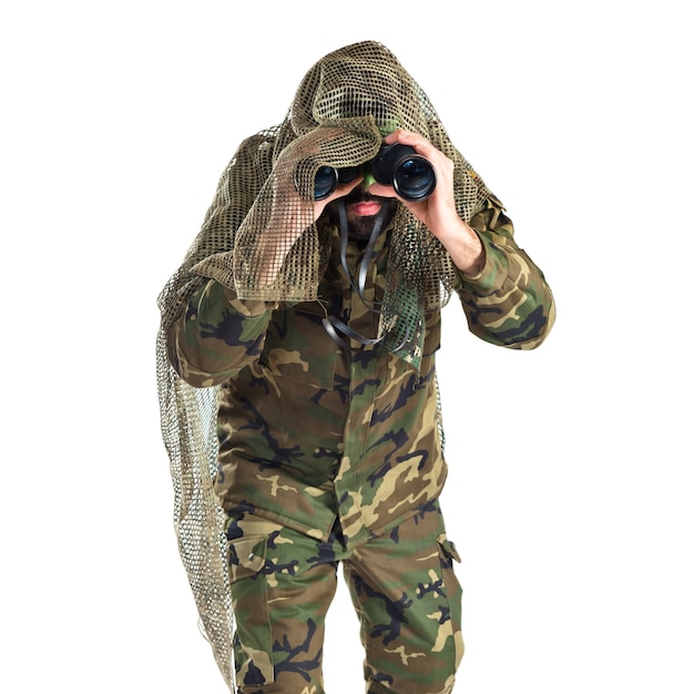 Soldier with binoculars over white background