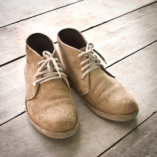 sole pair brown wood boots