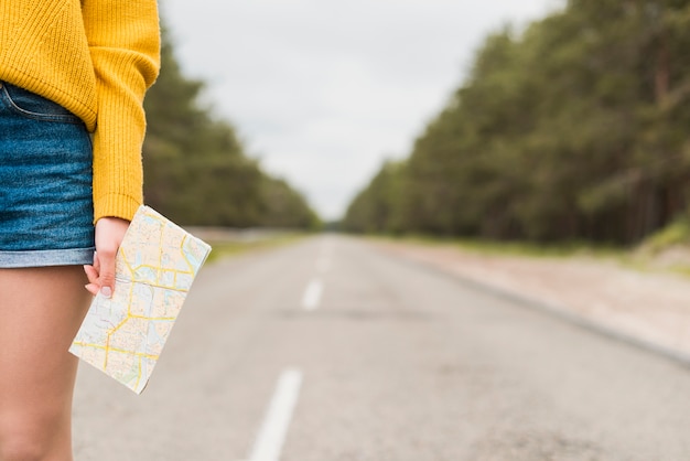 Free Photo solo traveler on the road with blurry background