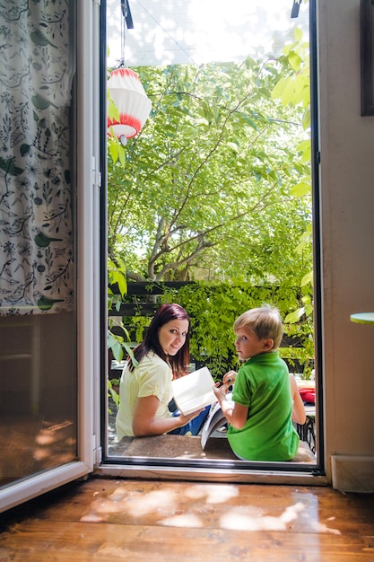 Son and mother posing in doorway