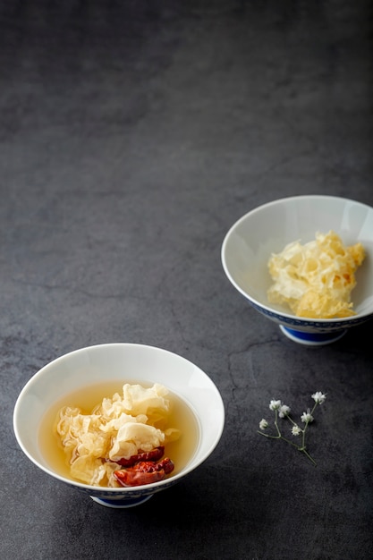 Soup white bowl on a grey background