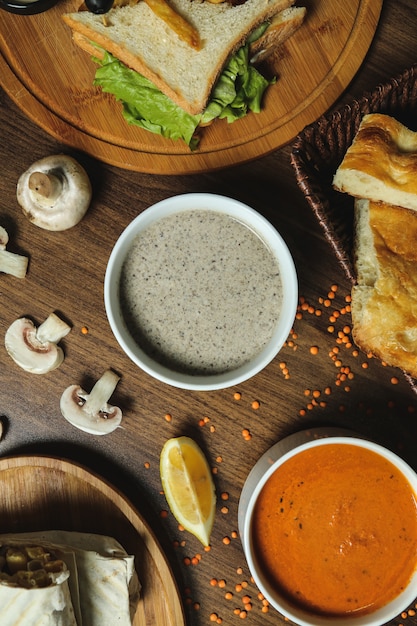 Free Photo soups mushroom lentil bread lemon top view