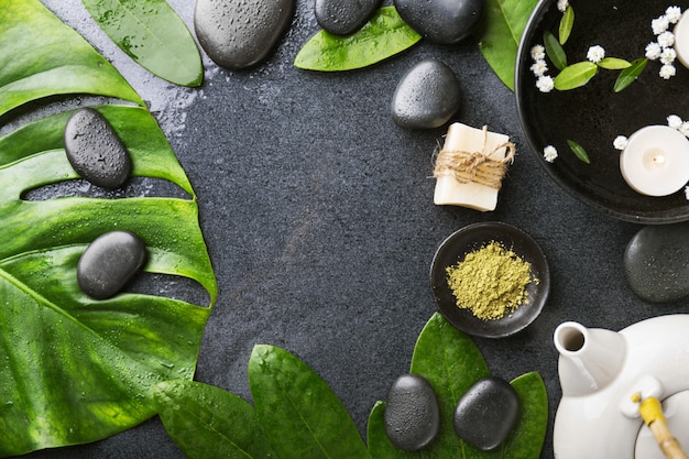 Spa accessories on dark wet background