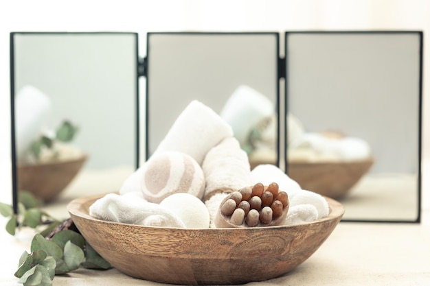 Free photo spa composition with body care products on a blurred background with a mirror