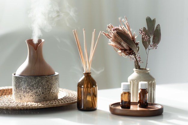 Free photo spa composition with incense sticks air humidifier and aroma oils