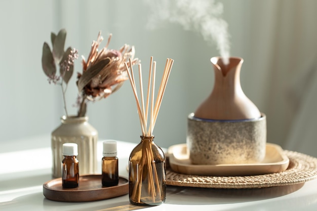 Free Photo spa composition with incense sticks air humidifier and aroma oils