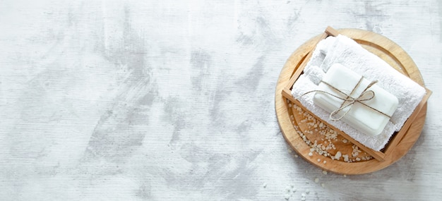 Spa composition with soap on a light wall