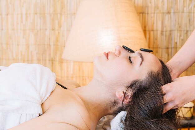 Spa concept with sideview of woman with long dark hair