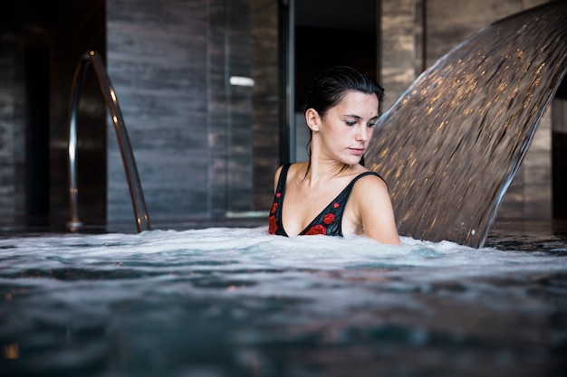 Free photo spa concept with woman relaxing in water