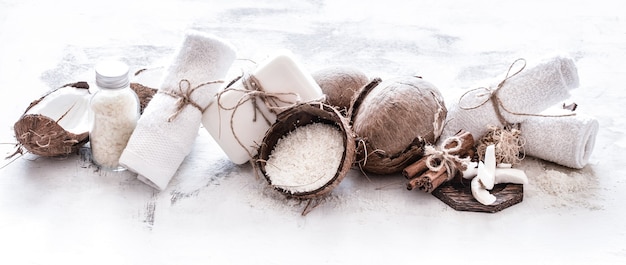 Free Photo spa still life of organic cosmetics with coconuts on a light wooden background, body care concept