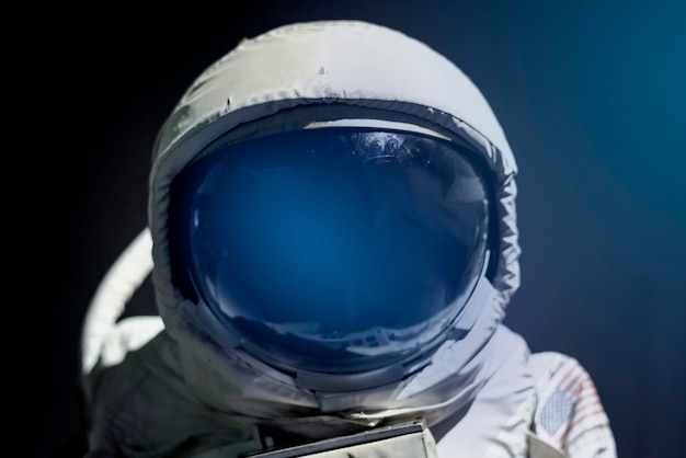 Spacesuit helmet visor close up on astronaut