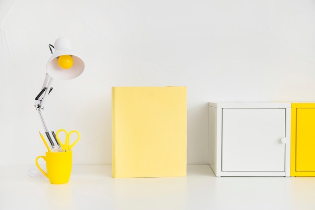 Spacious workplace with metal boxes and yellow notebook