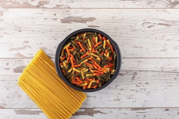 Free Photo spaghetti and gemelli pasta on the white wooden surface