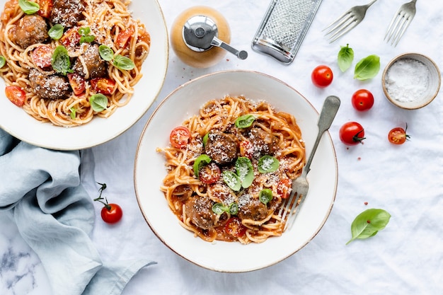 Spaghetti meatball topped with parmesan and basil