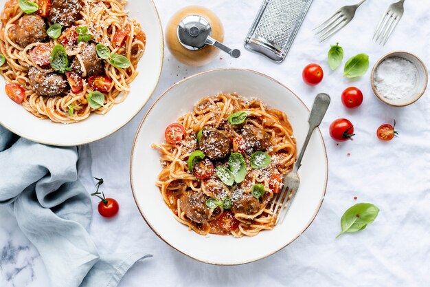 Spaghetti meatball topped with parmesan and basil