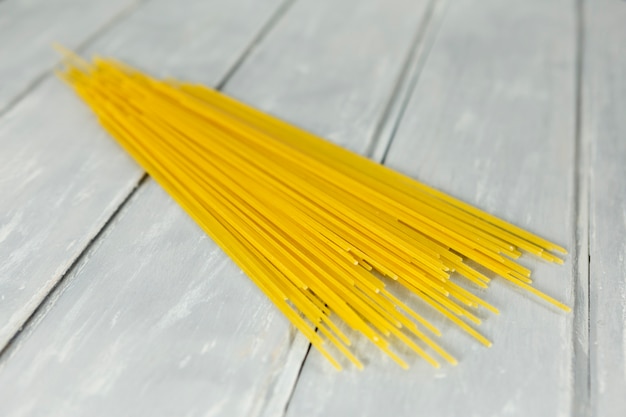 Spaghetti with wooden background