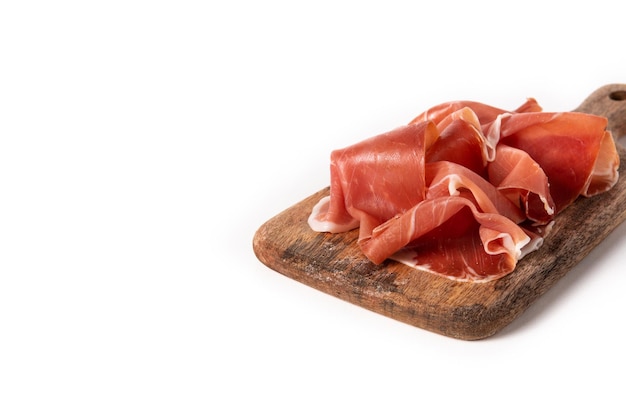 Free photo spanish serrano ham with olives and breadstick isolated on white background