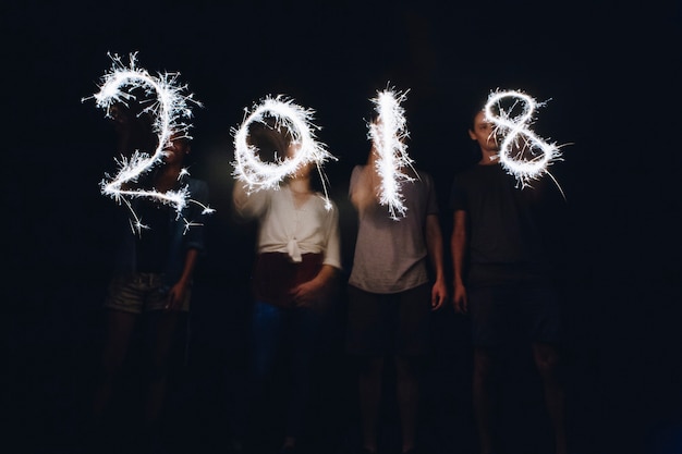 Free photo sparklers forming the numbers 2018 new years and celebration concept