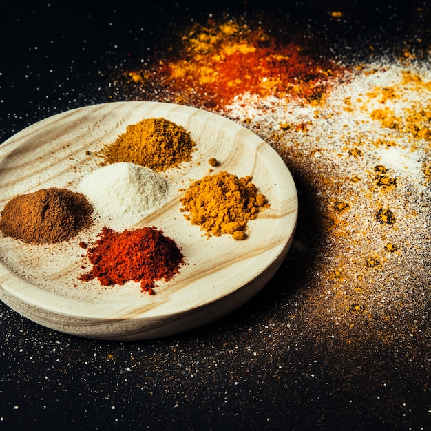 Spices decoration on wooden plate