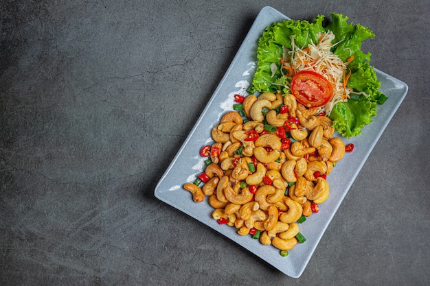 Spicy cashews topped with chopped hot chilli.