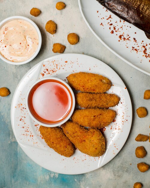 spicy chicken nuggets served with sweet chili sauce