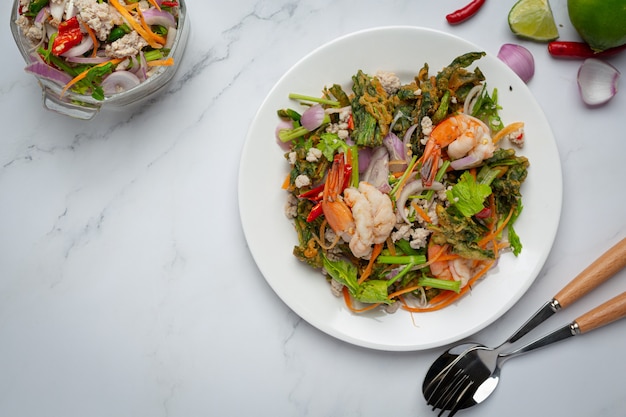 Free photo spicy crispy morning glory salad with shrimp, spicy fresh shrimp, thai food.