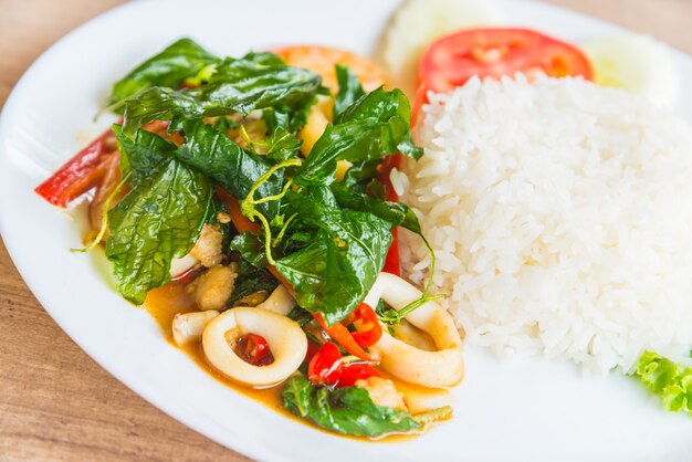 Spicy fried basil leaf with seafood and rice