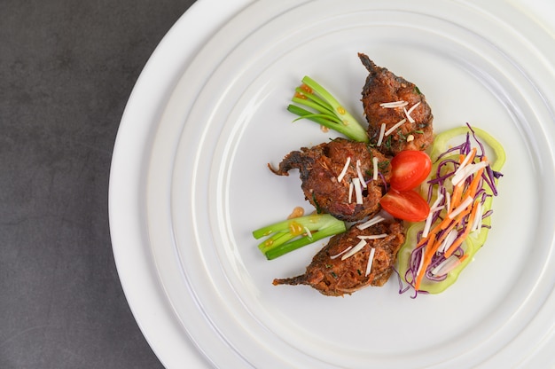 Spicy Fried Stir Catfish on white plate, Thai food.