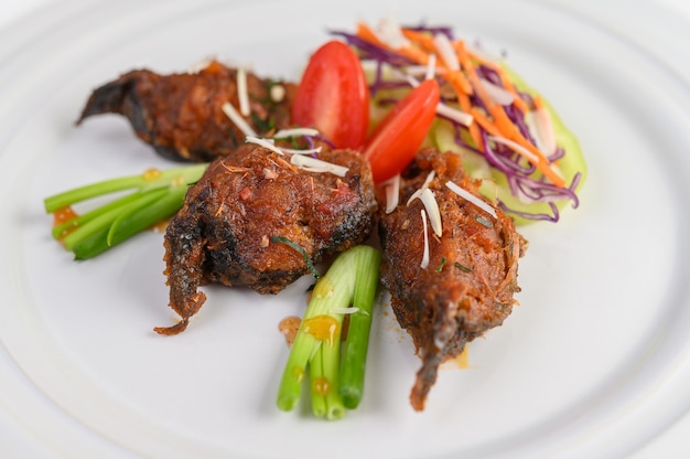 Spicy Fried Stir Catfish on white plate, Thai food.