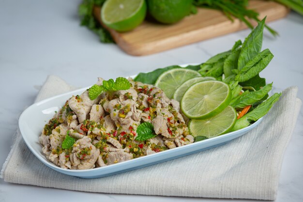 Spicy Pork Salad Served with fresh crispy kale stalks Thai food.