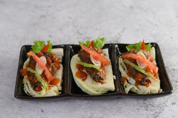 Spicy sardines in ceramic tray