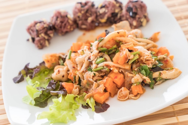 Spicy vegan salad with sticky berry and grain rice