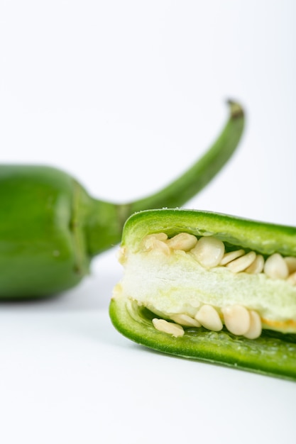 Spicy vegetable hot green pepper on white background