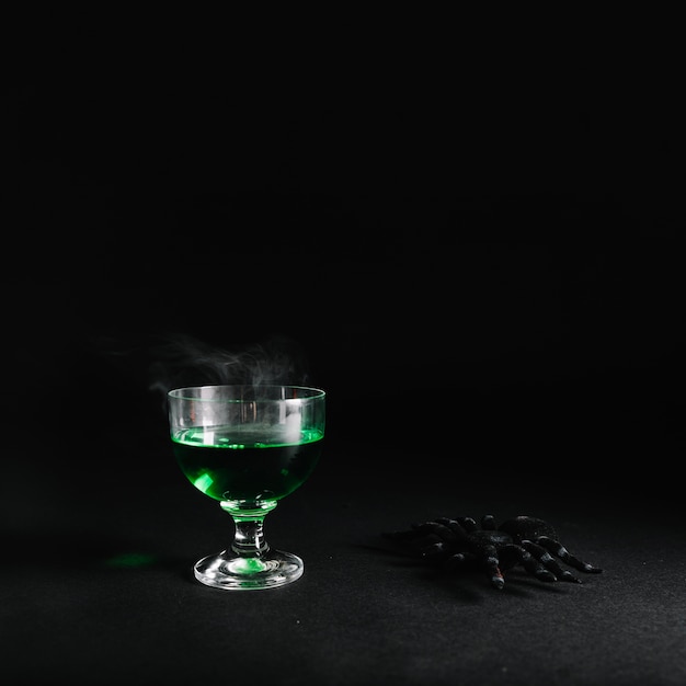 Free Photo spider and smoking poison in glass