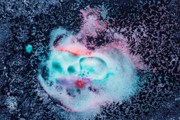 Free Photo splash of colorful foam on dark water