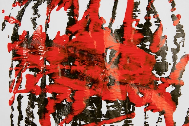 Free photo splashes of red and black paint