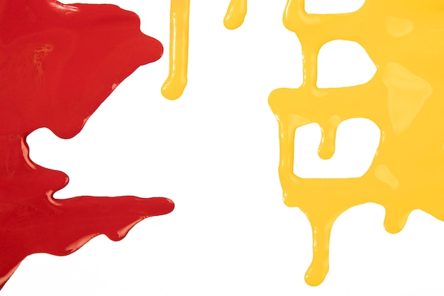 Free photo splashes of red and yellow paint