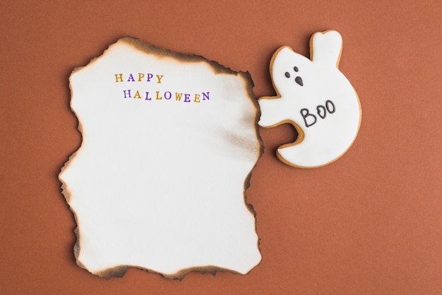 Free photo spook gingerbread near burning sheet of paper