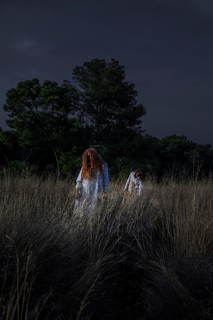 Spooky female zombie outdoors