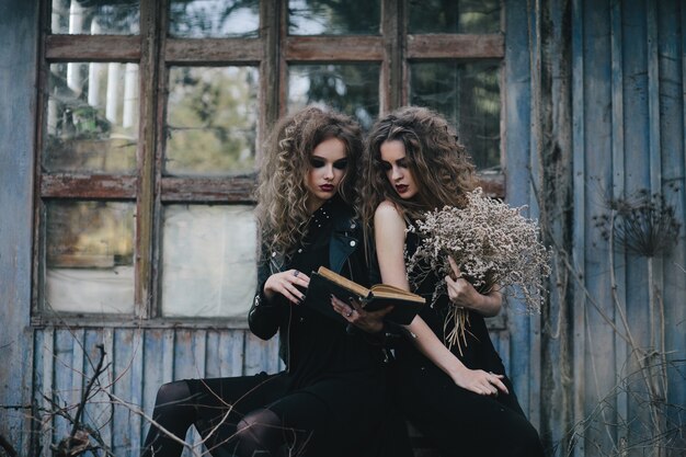 Spooky girls reading a spell