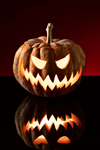 Free Photo spooky halloween pumpkin carving